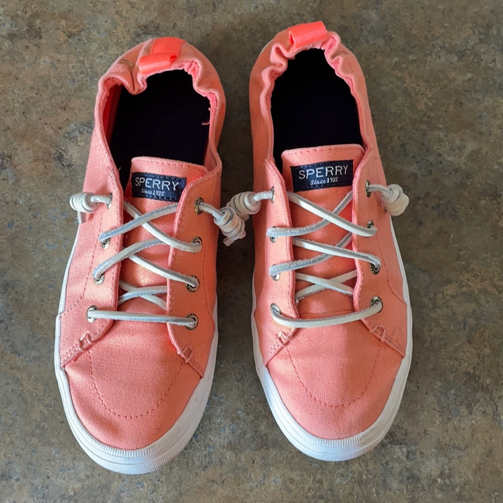 Women’s shimmering coral Sperry slip-on shoes